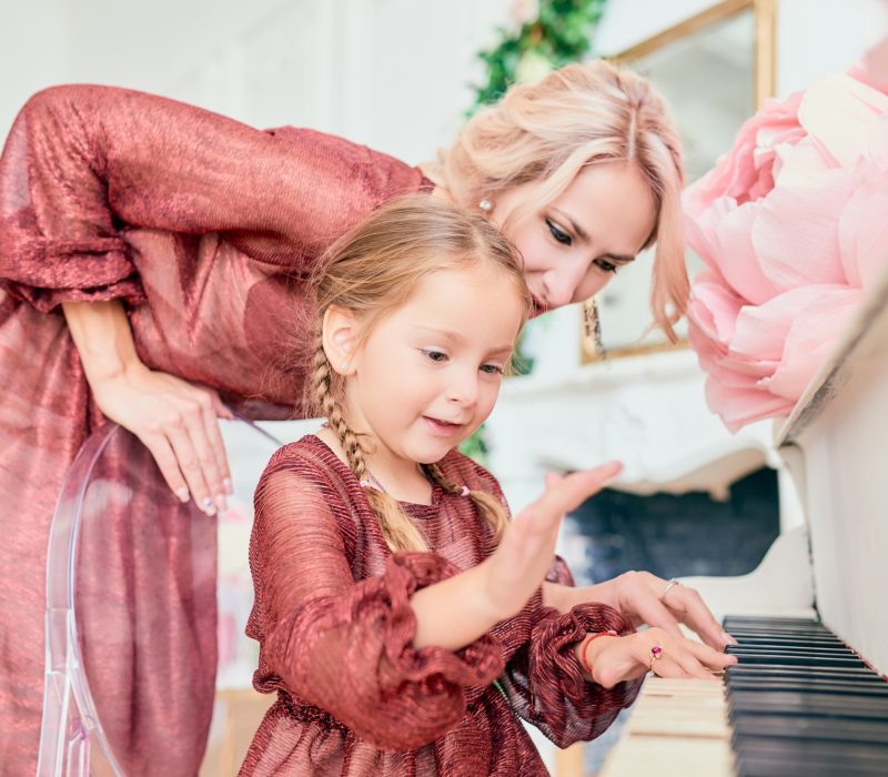 Charming little girl in an elegant dress